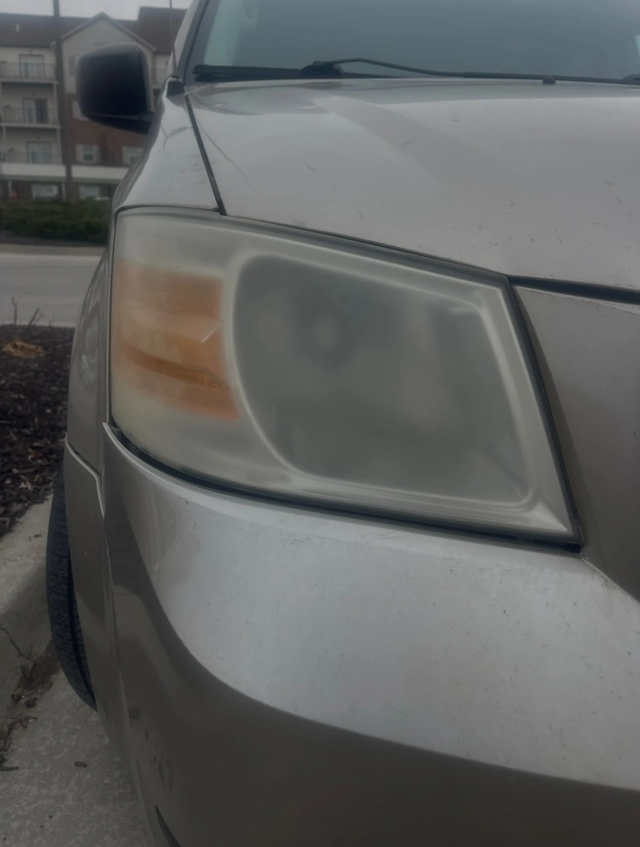 Before: heavily oxidized headlight — Kansas City headlight restoration